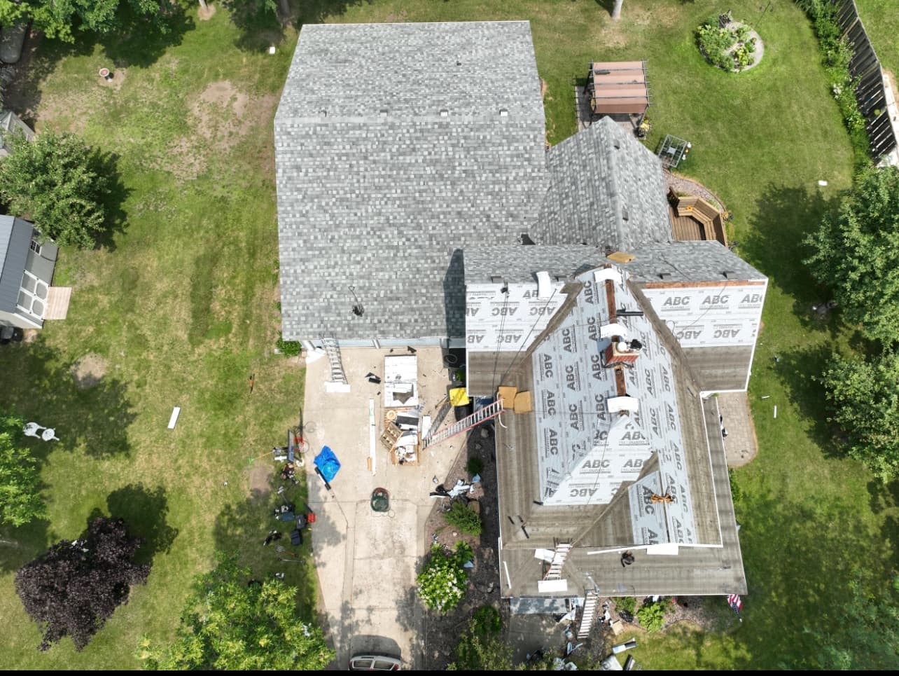 Vita Roofing project — installation in progress with underlayment and prepped shingles